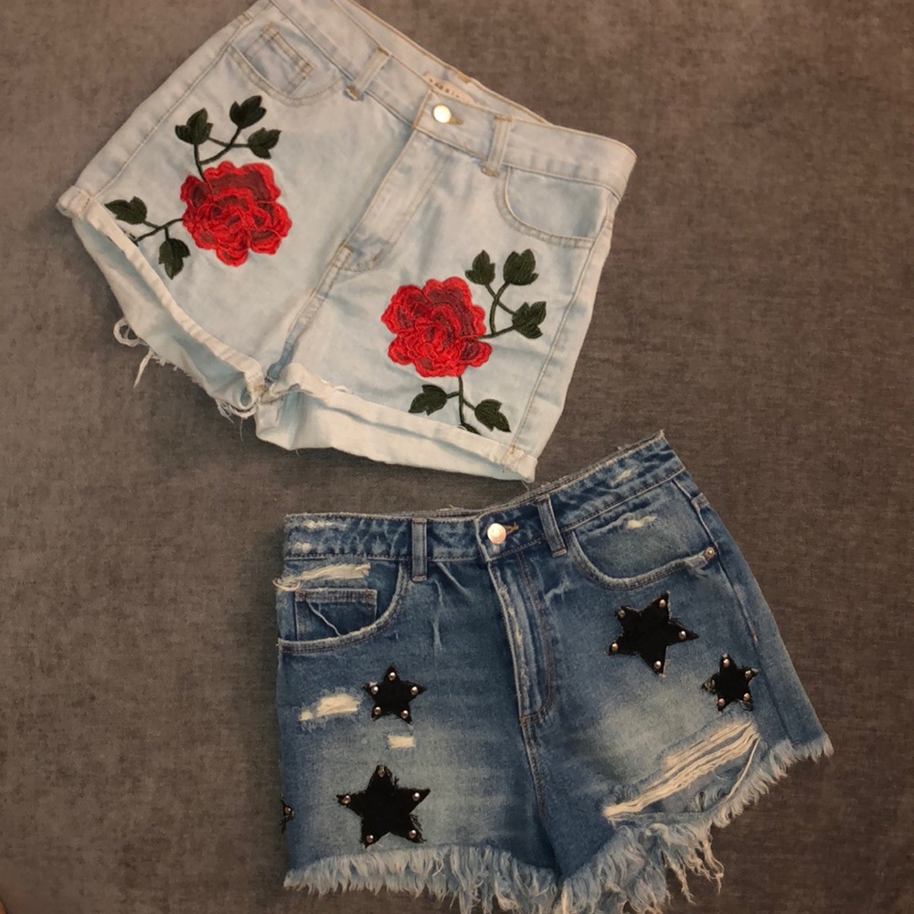 Two pairs of high-waisted denim shorts.